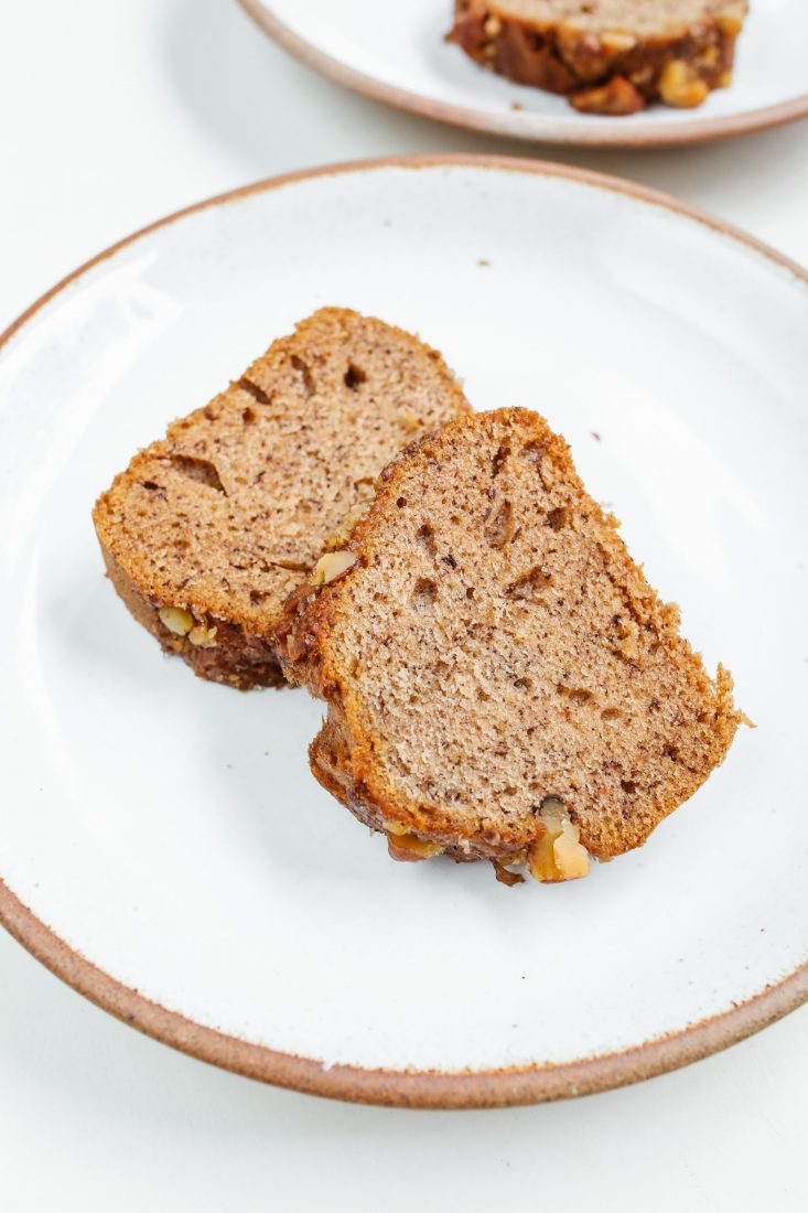 Slices of banana bread with walnuts on a plate